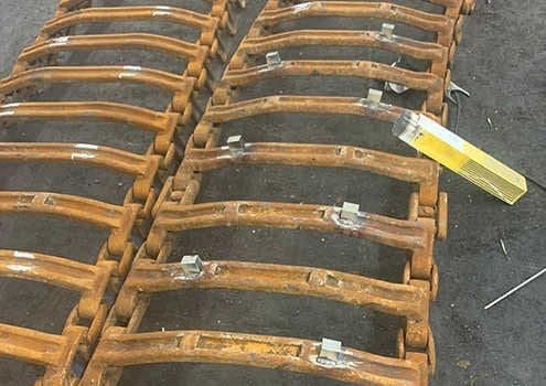 Tracks with newly welded studs
